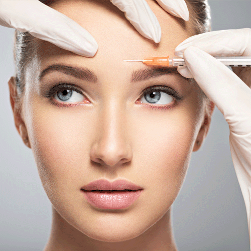 Woman getting botox injected into her forehead